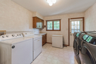 Laundry Room- chest freezer, dog run exit doo