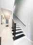 Entry Hallway with beautiful dark wood stairc