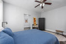 Bedroom featuring a plush queen bed