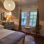 Queen bed, black out curtains and includes tv