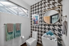Separate water closet with linen storage