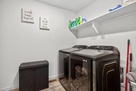 Spacious laundry room with full-size washer a