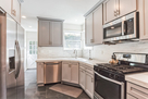 Floor to ceiling pantry is located next to Re