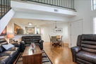 Living room with loft above