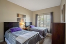 2nd bedroom with 2 twins and mirrored closet