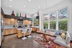 Scandinavian banquette  in light filled bay w
