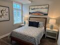 Queen size bed with marble nightstands