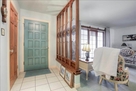 Entryway with gorgeous handmade stained glass