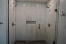 Walk-in shower with dual rainfall shower