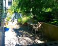 Private 200 sq ft patio surrounded by greener