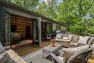 2 double doors open to outdoor living and gri