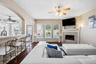 Spacious living room with T.V, fireplace, poo