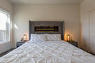King bed with modern fireplace
