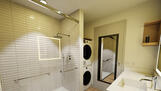 Modern bathroom with in-suite washer/dryer