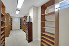 Primary Closet: has the shoot to laundry room