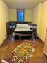 Full bedroom with books and toys