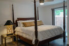 Elegant primary bedroom with king bed