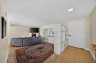 Front door entry to well-furnished sunken  li