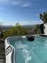 hot tub and valley/city view
