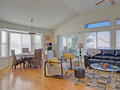 spacious living area with fireplace, hardwood
