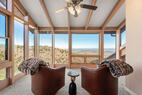 Sunroom with cozy seating, views for miles.