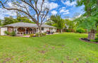 Spacious backyard with mature trees