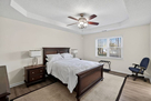 Raised trey ceiling in master bedroom.