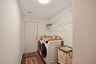 Laundry Room with GE Washer and Dryer