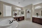 Downstairs Primary Bathroom, view two.