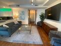 65 inch TV, beautiful artwork and furniture