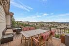 Private deck with dining set and valley views