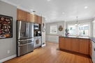 A large peninsula counter separates the kitch
