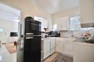 Kitchen with retro fridge, stove, and dishwas