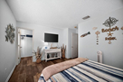Bdr 2 w/queen bed/wall mounted TV, walk-in cl