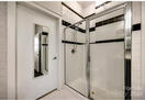 Large tiled shower w glass doors