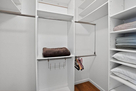 The upper level guest bedroom walk-in closet 