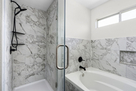 Spacious master bath with soaking tub and gla