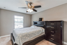 Bedroom 2 with Queen bed, chest of drawers an