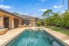 Backyard w/pool & jacuzzi.
