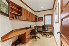Office off hallway with printer.
