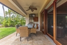 Covered lanai, propane BBQ & backyard.