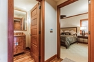 Half bath off hallway w/view of Bedroom #1.