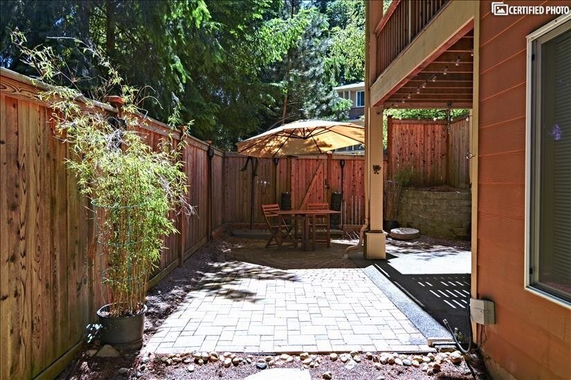 Fully fenced backyard with gate