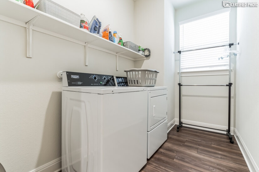 Full size commercial washer/dryer and drip rack.