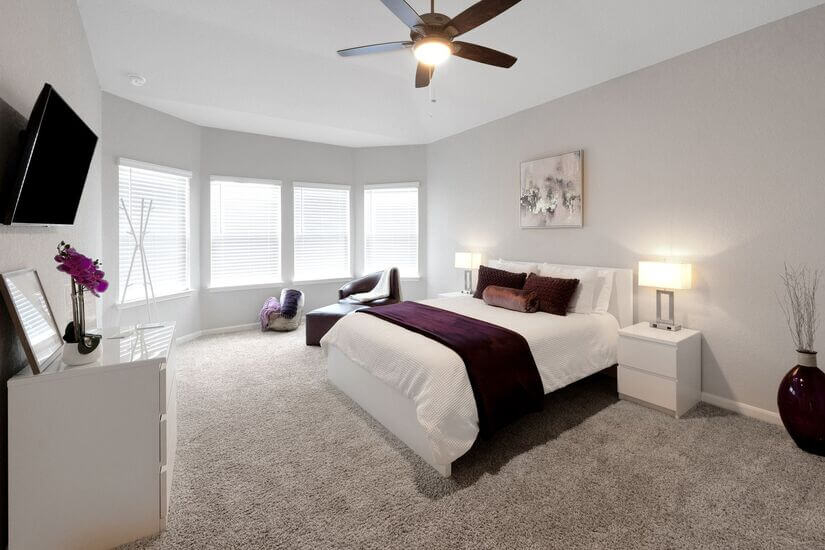 Master bedroom with view of the backyard