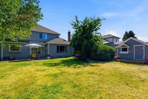 Large backyard with playhouse