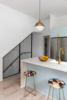 Bar-seating kitchen with modern white tones
