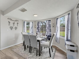 Bright Dining Room with Backyard Views