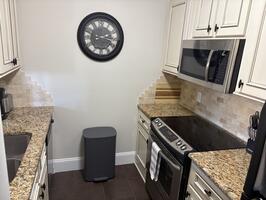 Full kitchen with full sized stove