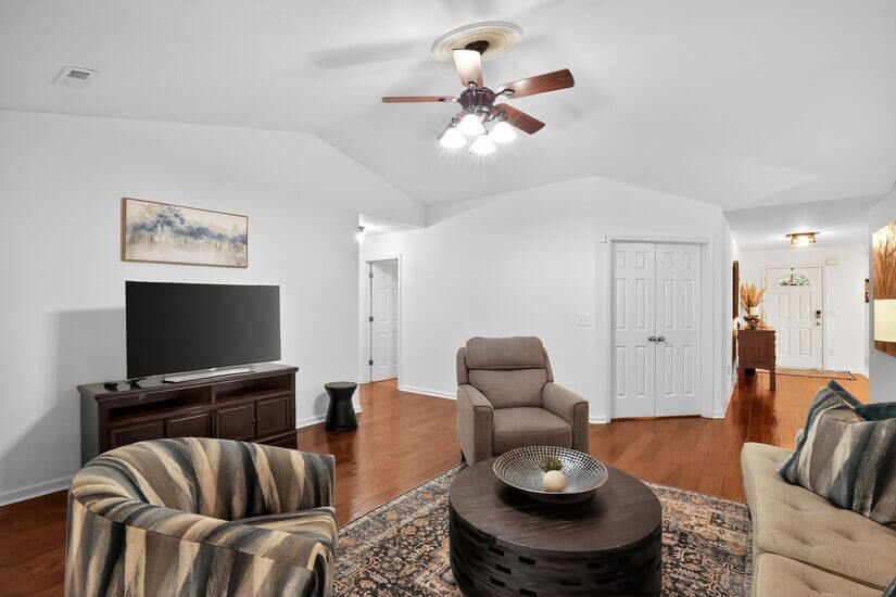 Spacious Living Room with Smart TV and Natural Light